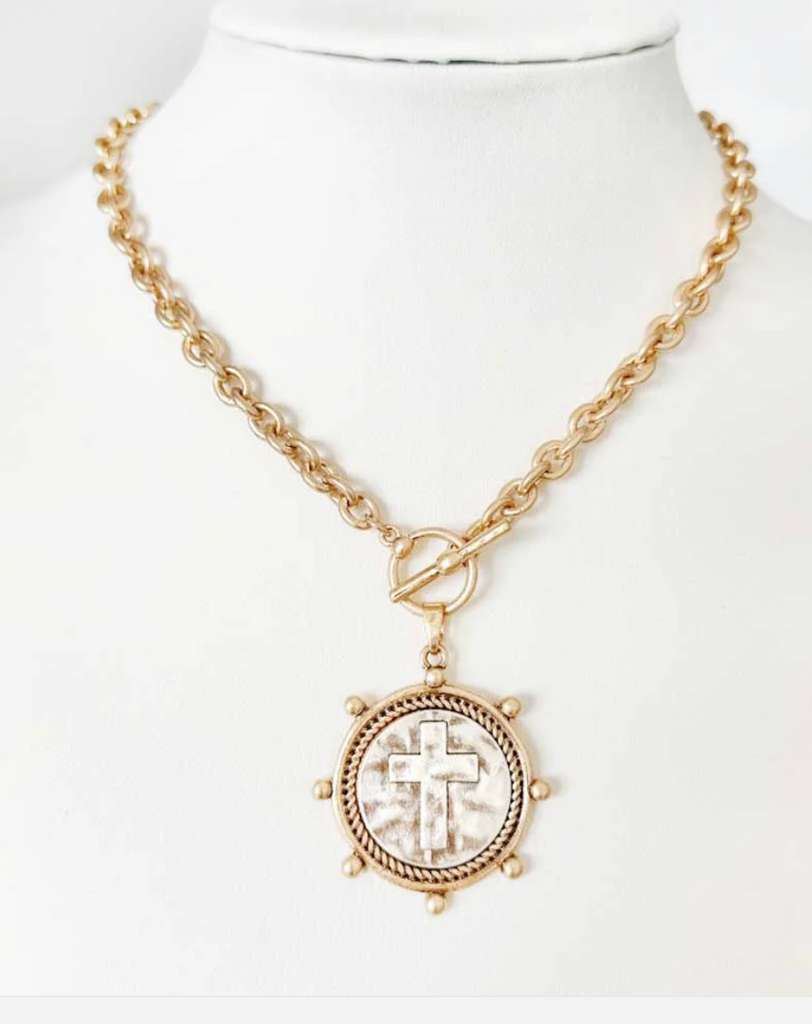 worn gold chain with stamped cross coin necklace