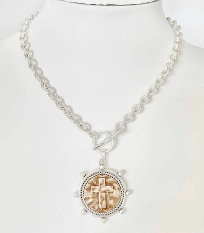 worn silver chain with stamped cross coin necklace