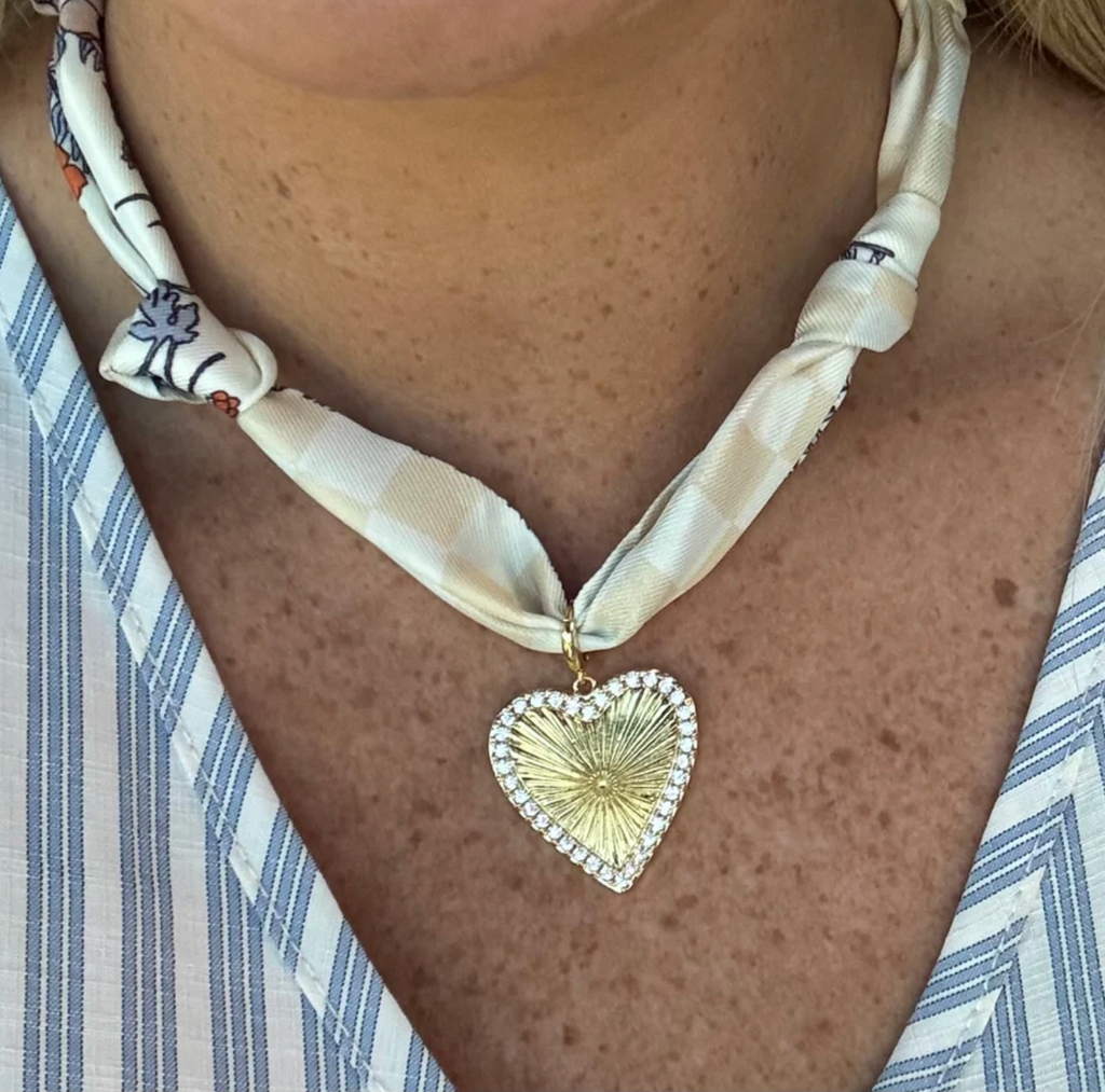 cream and blue knotted scarf necklace with rhinestone charm