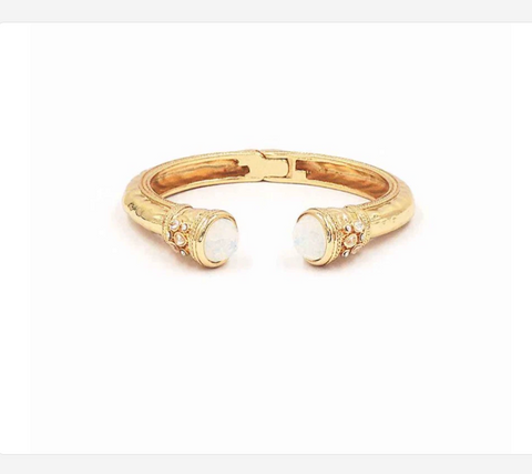 gold metal hinged with white crystal stone bracelet